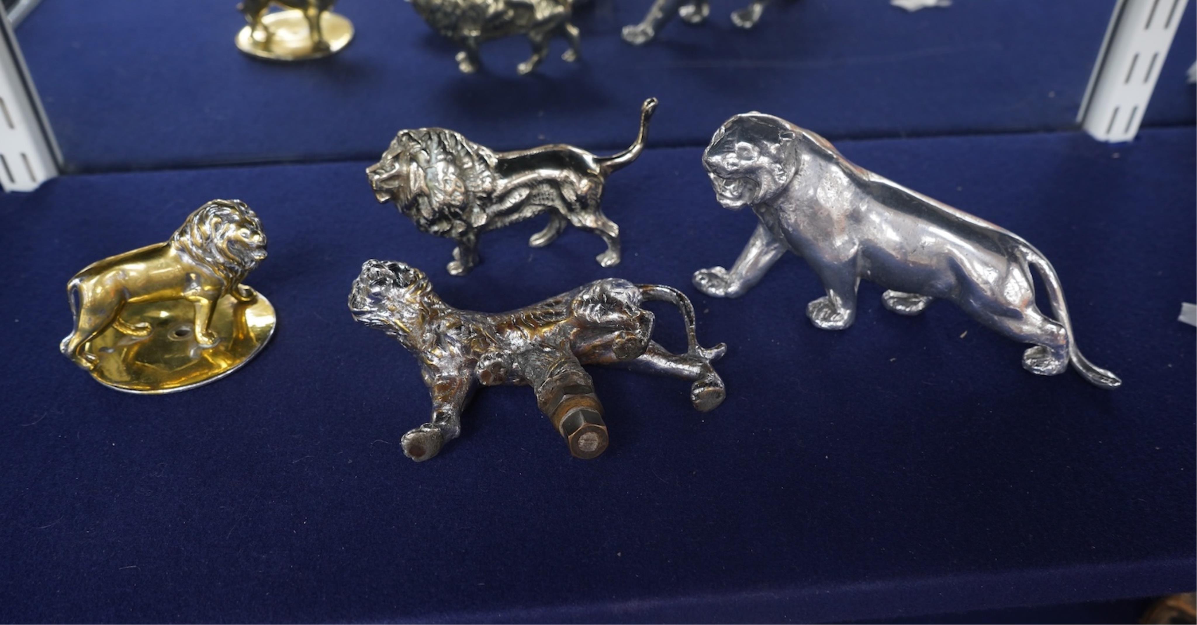 Four lion and big cat related brass and chrome car mascots/figures, consisting of two lions, a tiger and another, possibly a panther. Condition - fair, some losses to chrome.